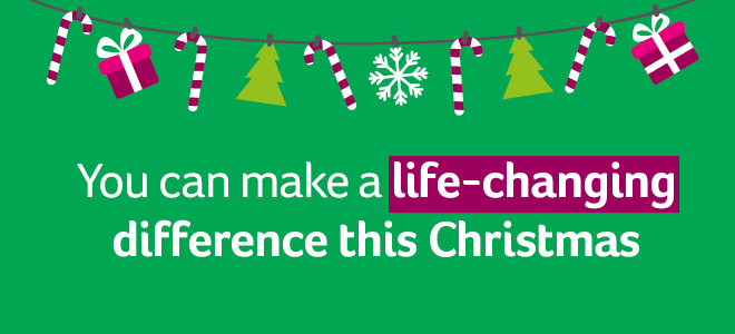 green background with Christmas hanging decoration of presents and candy canes along top, white text "You can make a life-changing difference this Christmas" with plum highlight under life-changing