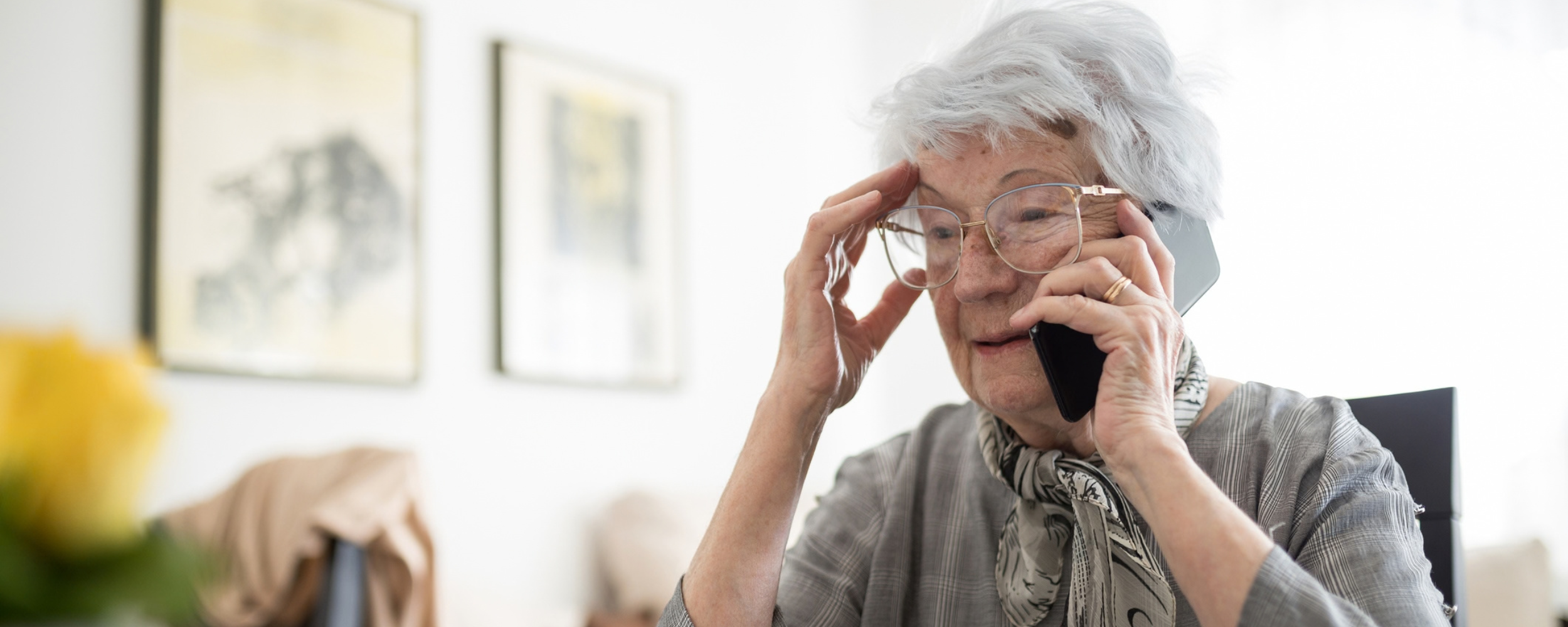 Older woman on the phone looking frustrated