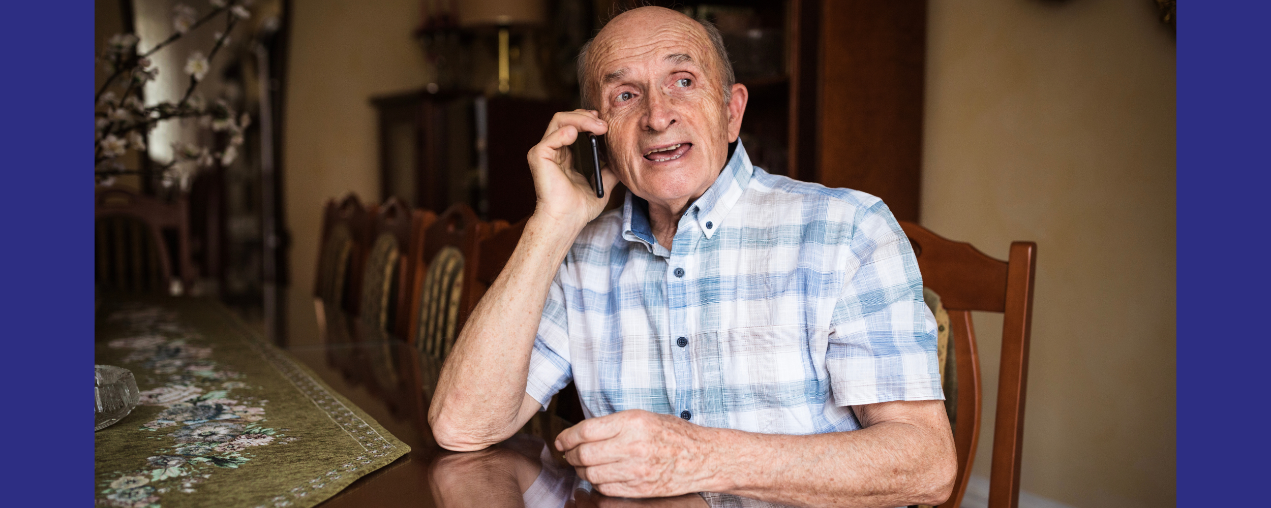 older man on the phone looking away from camera