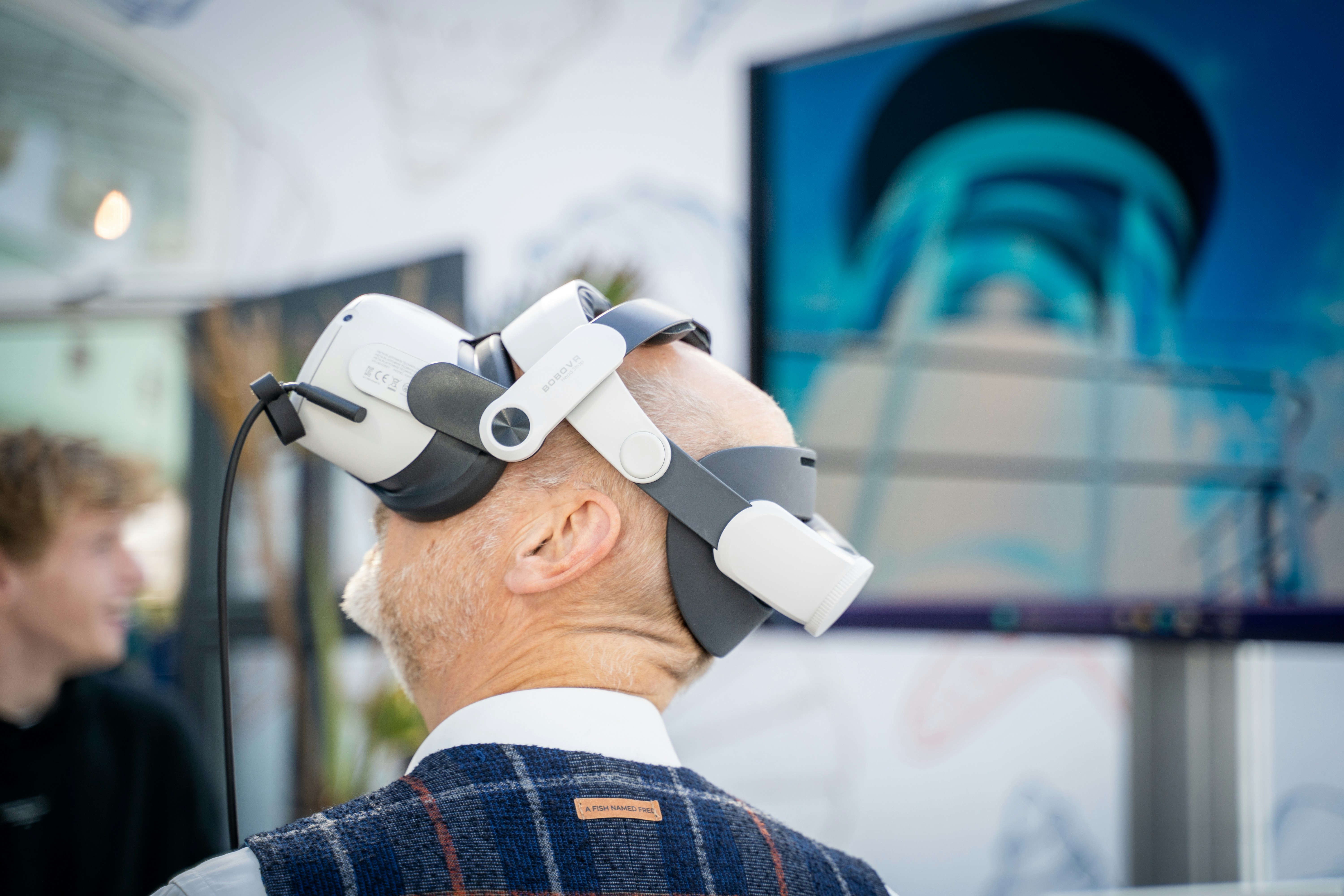 man with a VR headset in front of training screens