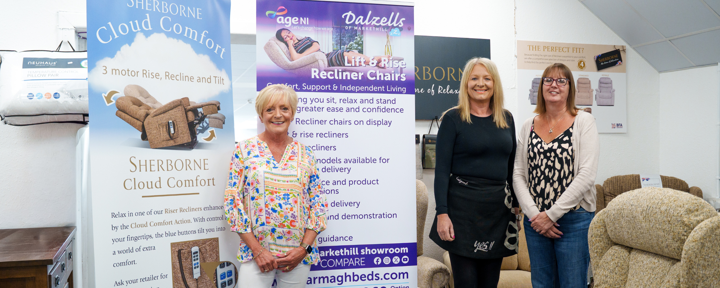 Kathryn Murdock and Sharon Dalzell from Dalzells Beds with Mandy Wilson, Age NI Charity Director, in the Dalzells Beds showroom in Markethill marking the launch of the new partnership supporting better sleep, comfort and independent living across Northern Ireland.
