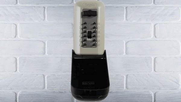 image of a key safe mounted to a brick wall