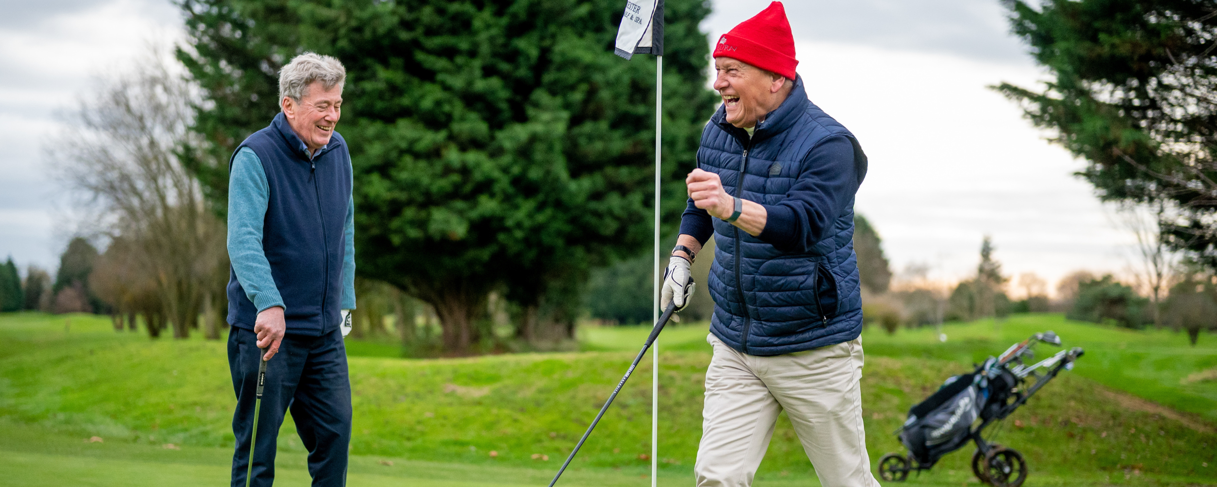 two older men golfing